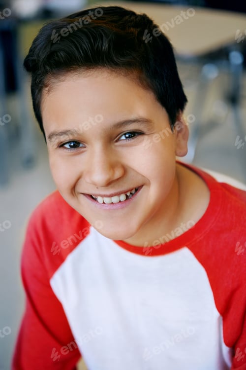 Preview: Kid, boy and happy with portrait in classroom for education, knowledge and academic development