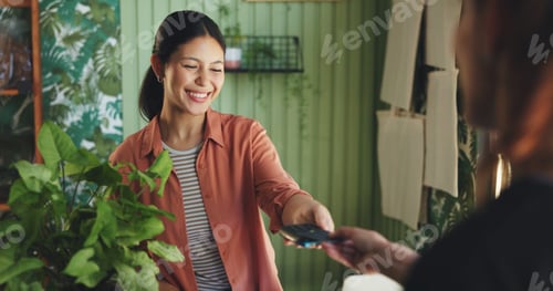 Preview: Woman, POS machine and credit card at nursery for payment, easy transaction and discount deal