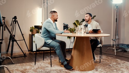 Preview: Podcast, men and talk for interview in studio, business show and laugh at funny joke