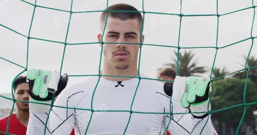 Preview: Goalkeeper, soccer and man by net outdoor for sports, match training or determination