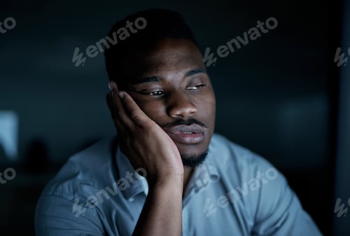 Preview: Black man, computer and bored in night office for editing, deadline and journalist website glitch