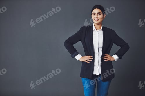 Preview: Happy woman, portrait and studio with confidence for business fashion on a gray background