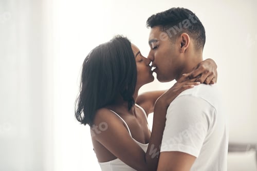 Preview: Kiss, love and passion with couple in bedroom of home together for bonding, connection or intimacy