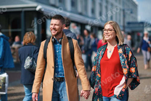 Preview: Travel, holding hands and couple in city for walking to explore on holiday, vacation and trip