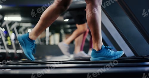 Preview: Legs, person and running on treadmill at gym for cardio exercise, burning calories and fitness