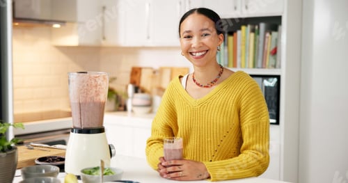 Preview: Woman, smoothie and smile in kitchen, portrait and excited with glass for gut health benefits