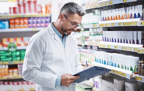 Preview: Chemist, man and writing in pharmacy with clipboard, quality assurance and inspection for medicine