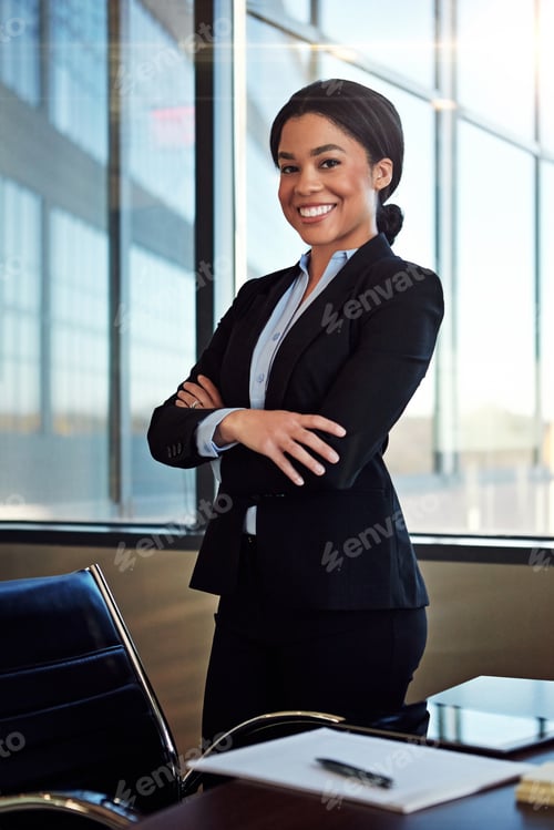 Preview: Arms crossed, happy and portrait of black woman lawyer in office for justice or legal profession
