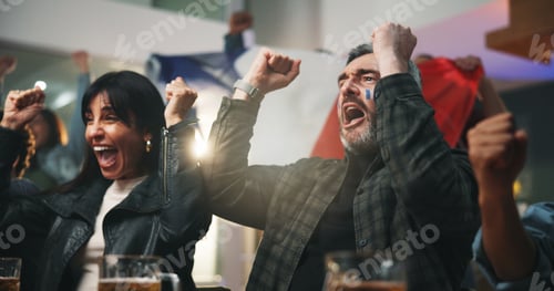 Preview: Happy people, winning and watching tv with fist pump for success, sport victory or support in pub