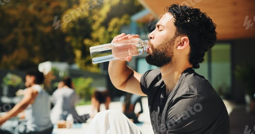 Preview: Drinking, outdoor and man with water at pilates class for break, relax or recovery on wellness
