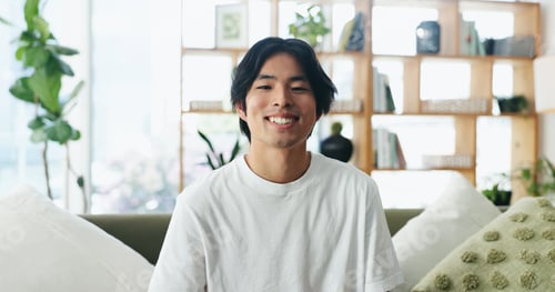 Preview: Happy man, portrait and relax on sofa for health, wellness or holiday for comfort in home