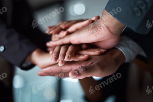 Preview: Huddle, stack of hands and teamwork with business people in office at night for solidarity or unity