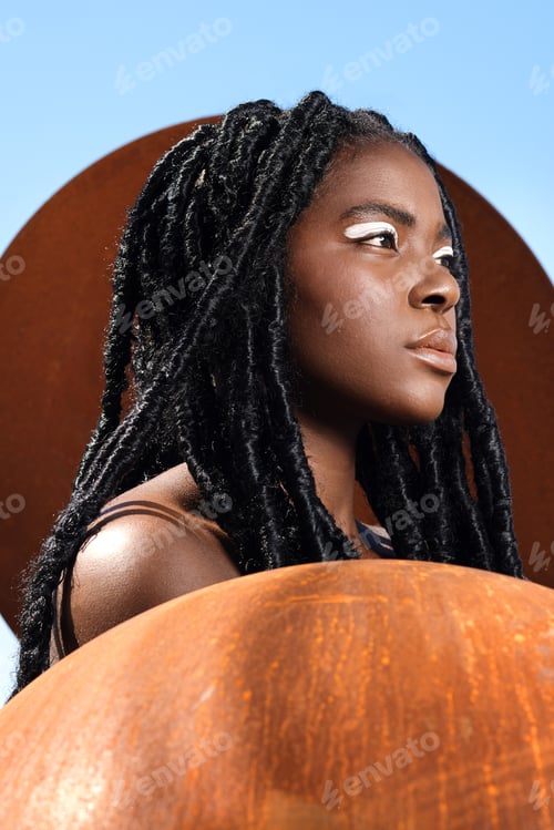Preview: Braids, makeup and black woman with cosmetics outdoor with skin glow for artistic expression