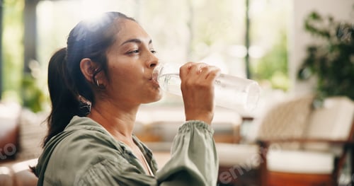 Preview: Thirsty, woman and drinking water in lounge with bottle, wellness and natural detox for gut health