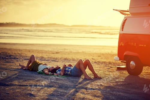 Preview: Road trip, couple and rest on beach at sunset for holiday adventure, sungazing and connection