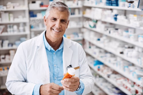 Preview: Happy, portrait and man with pills, pharmacy and confident for career development