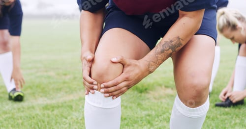 Preview: Knee, pain and rugby with hands of woman on field for sports injury, inflammation and strain
