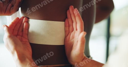 Preview: Hands, physiotherapy and patch on back for injury, recovery and rehabilitation at clinic