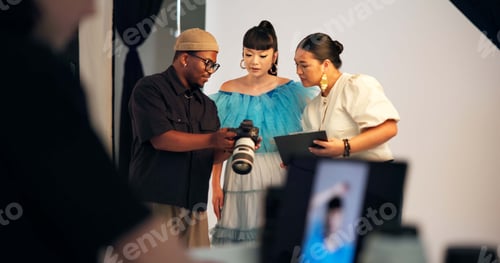 Preview: Laptop screen, photoshoot and people in studio, camera and selection for magazine catalog
