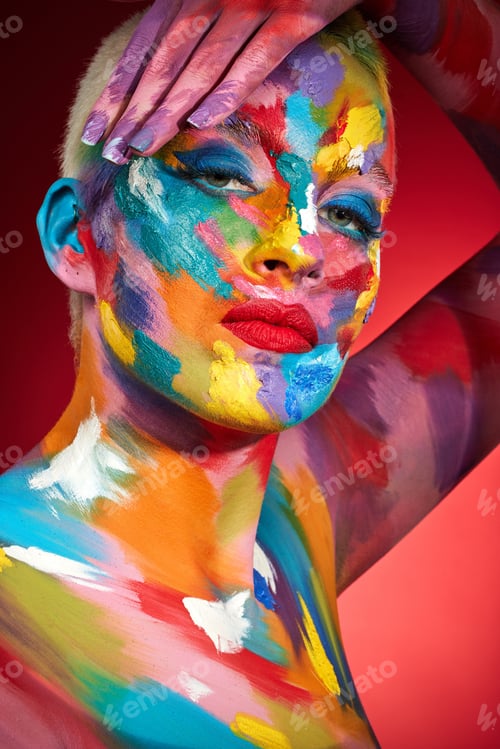 Preview: Woman, face paint and makeup with rainbow in studio for texture, art deco