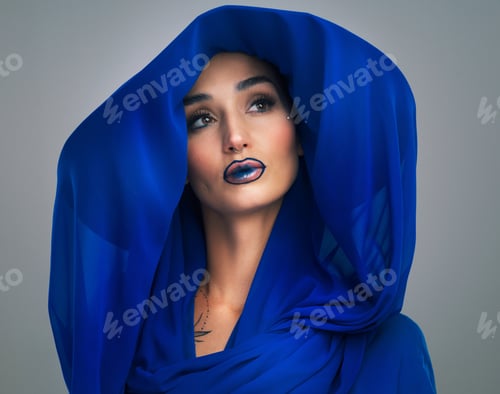 Preview: Woman, fashion and creative makeup in studio with scarf, blue lipstick or unique style