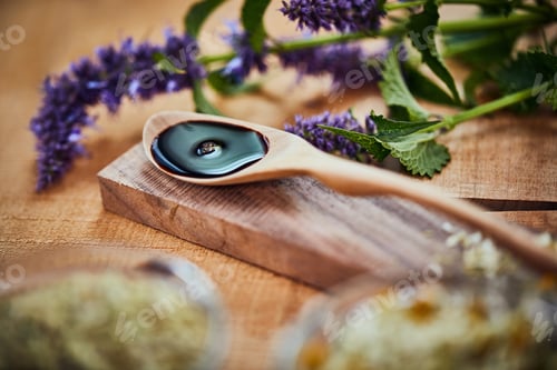 Preview: Plants, essential oil and spoon at spa with aromatherapy ingredients for natural therapy