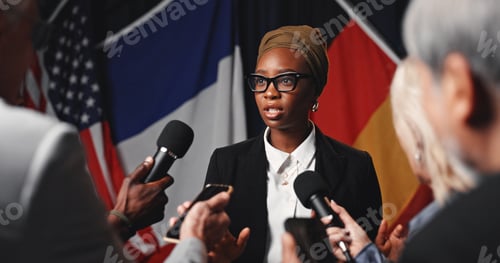 Preview: Woman, press conference and flags at international seminar, journalist group or interview at event