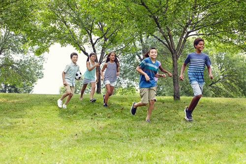 Preview: Smile, friends and kids with running at park for summer break, holiday adventure and freedom