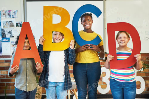 Preview: Children, sign and letters of alphabet in classroom with smile, portrait