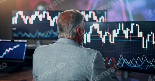 Preview: Back of man, computer and trading at night in office with graphs, report and price for investment