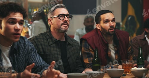 Preview: Anxiety, watching tv and men in pub for sports game with championship for entertainment together