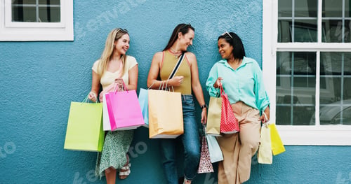 Preview: Happy women, friends and wall with shopping bags for fashion discount, sale or promotion together