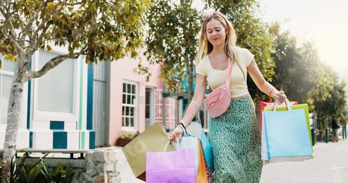 Preview: Shopping bag, sale and heavy with woman in city for black Friday deal, overconsumption