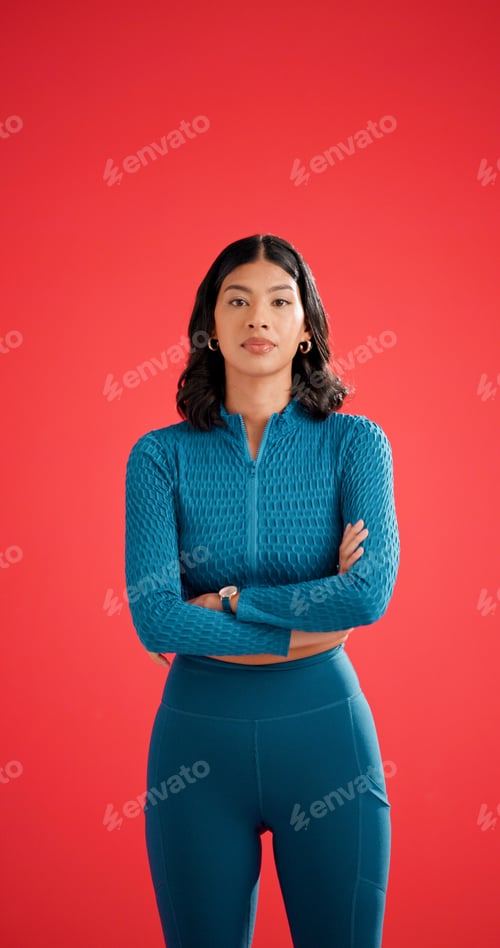 Preview: Portrait, athlete and woman with arms crossed in studio, serious and pride for fitness with workout