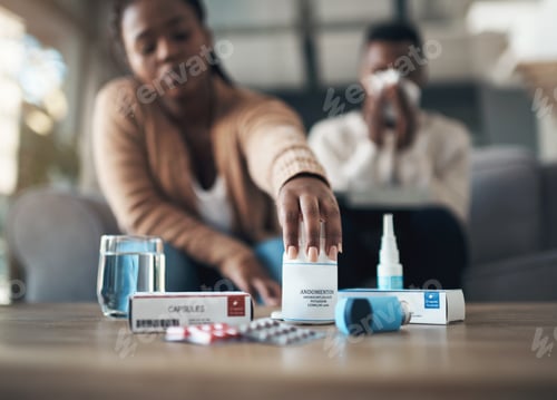 Preview: Couple, hands and pills with water on sofa for prescription, medication or side effects in home
