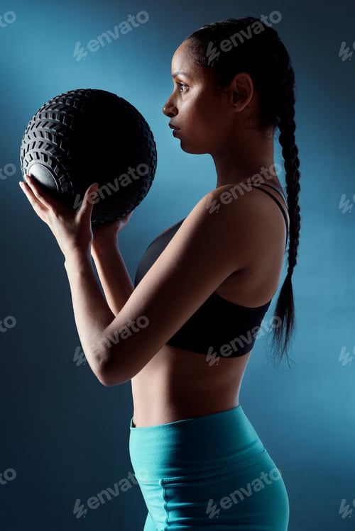 Preview: Fitness, power or woman in studio with medicine ball, strength training