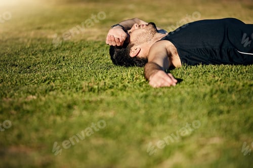 Preview: Tired, fitness and man with resting on grass for workout challenge, exercise burnout and recovery