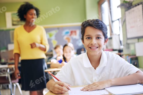 Preview: Portrait, happy boy and student in classroom with pencil for knowledge, education and assignment