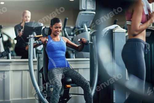 Preview: Exercise, chest press and woman in gym, machine and intense training for health benefits