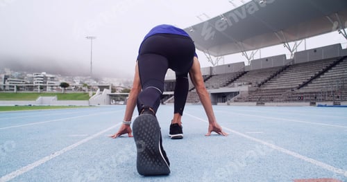 Preview: Runner, back of man and ready on track to start workout, marathon training and cardio at stadium