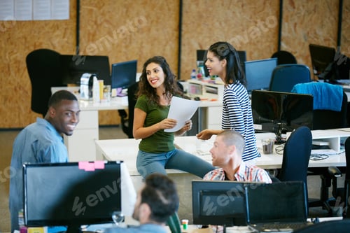 Preview: Happy team, meeting and talk in office with paperwork for marketing strategy
