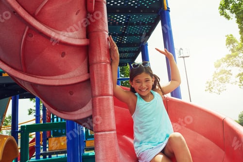 Preview: Playground, child and smile portrait on slide outdoor for adventure, fun activity and sensory play