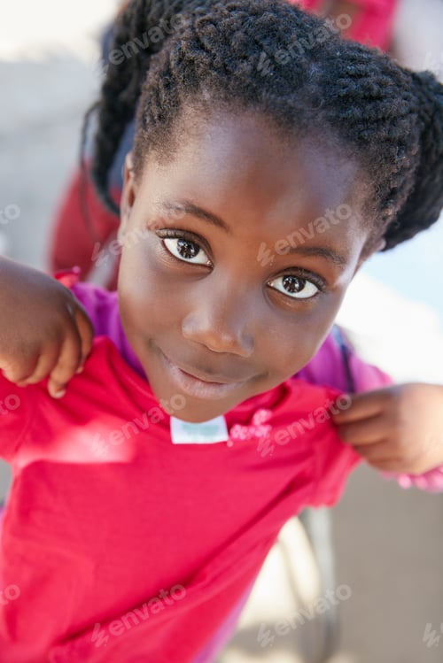 Preview: Happy, black girl or portrait with clothing for charity donation, poverty or outreach in rural area