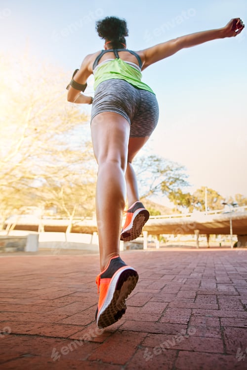 Preview: Back, running and woman in city, fitness and training for competition, wellness and challenge