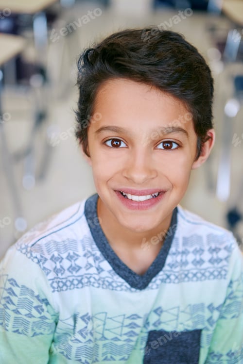 Preview: Kid, boy and smile with portrait in classroom for learning, knowledge and academic development