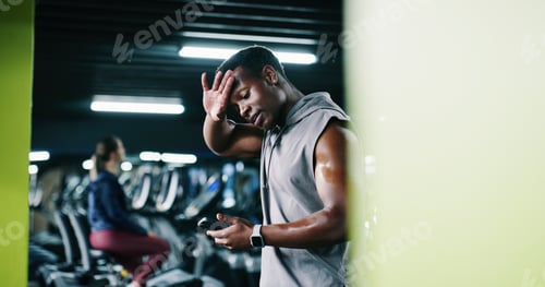 Preview: Man, sweating and scroll in gym with phone, workout break and notification for social media update