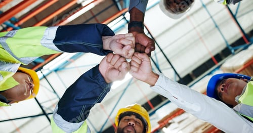 Preview: Hands, fist bump and team with low angle at warehouse for logistics, motivation