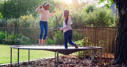 Preview: Trampoline, jumping and children in backyard for fun, playing and bonding together on weekend