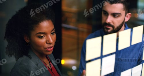 Preview: Night, meeting and business people at glass wall with sticky note, collaboration
