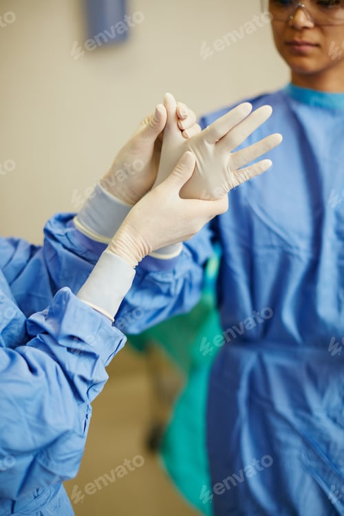 Preview: Hands, surgeon and help with gloves at hospital with team, prepare and ready for job in operating